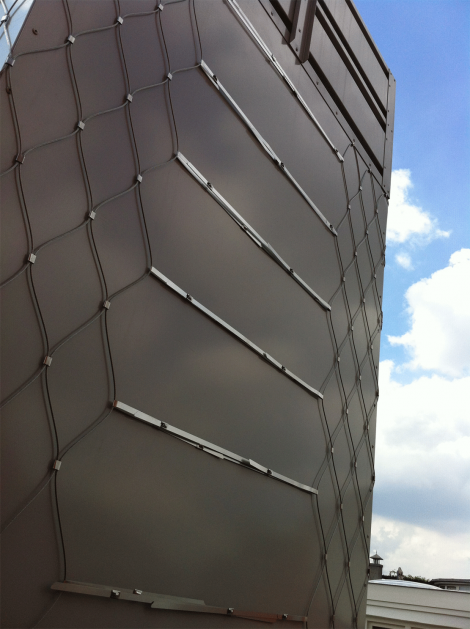 Custom designed stainless steel lattice work, chimney, back.
